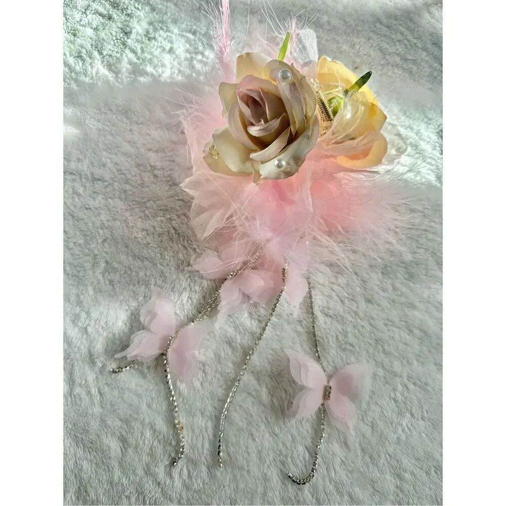 Light pink rose with feather hair claw